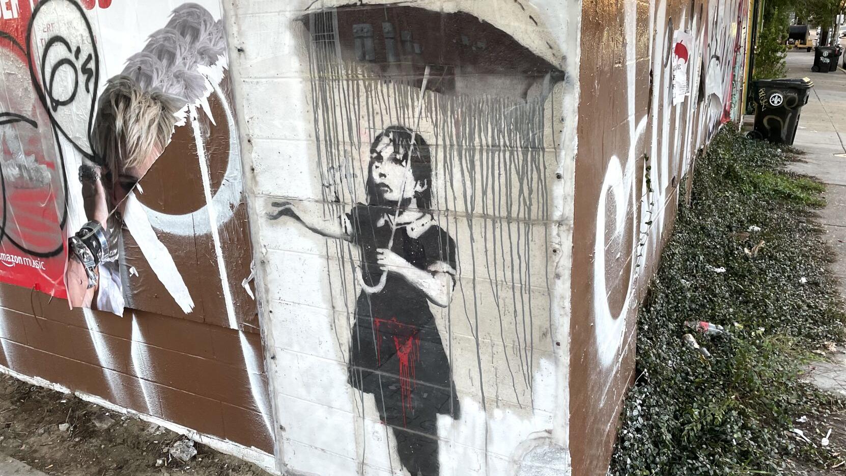 Vandalized Banksy graffiti painting in New Orleans is restored by fast-acting artists